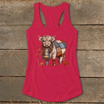 Highland cow wearing a plaid scarf and patchwork blanket on a pink tank top.