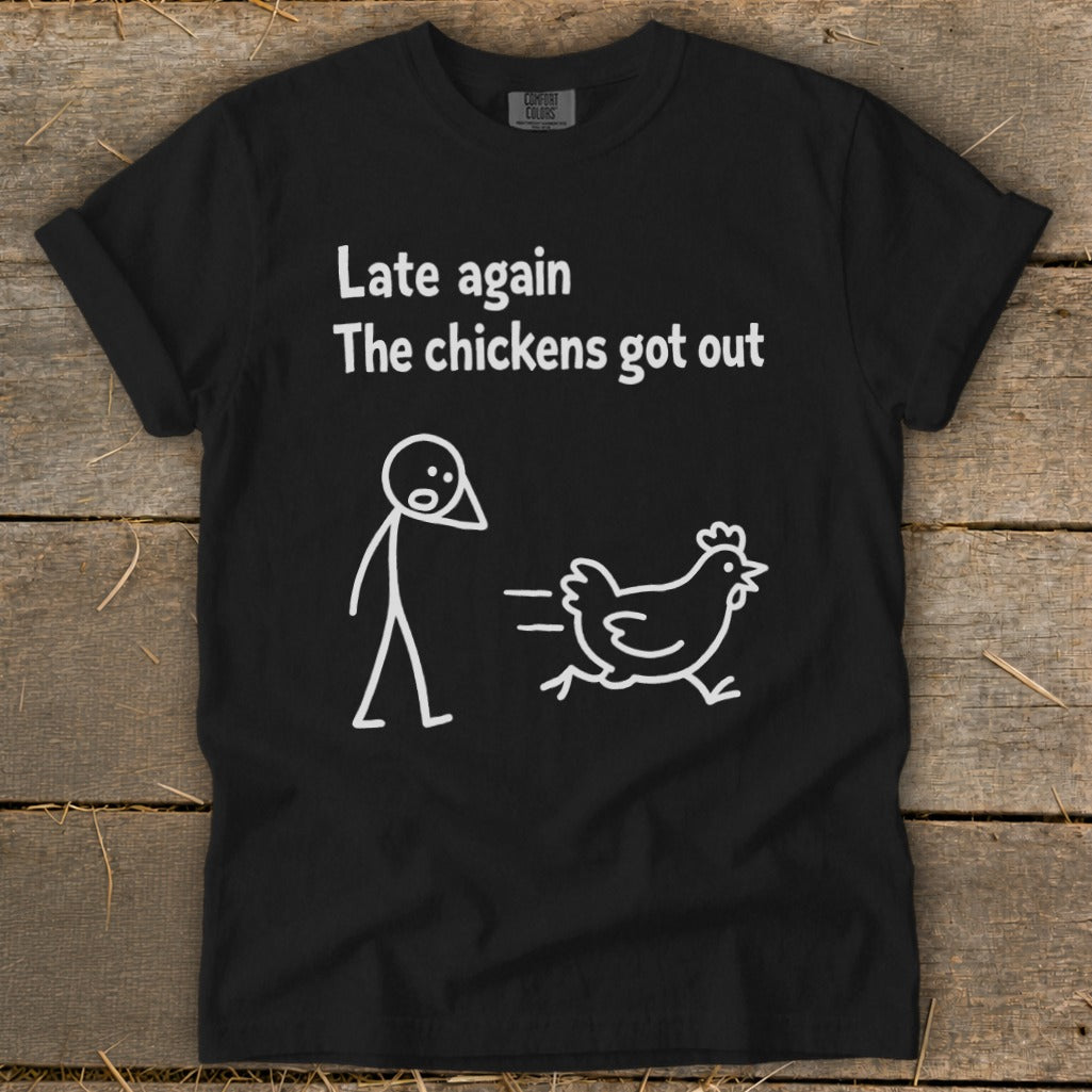 Black t-shirt with "Late again, The chickens got out" text and stick figure chasing a chicken.