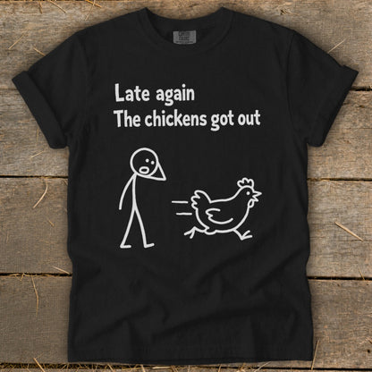 Black t-shirt with "Late again, The chickens got out" text and stick figure chasing a chicken.