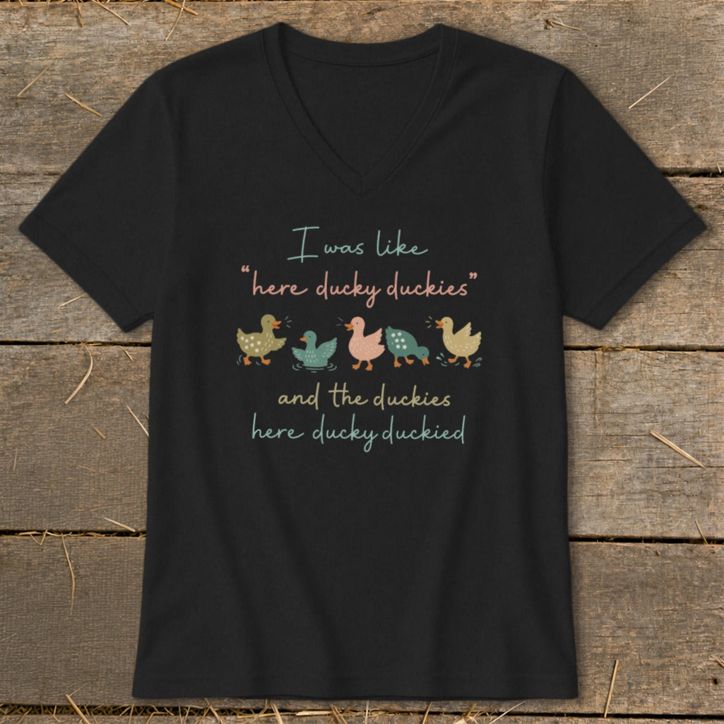 Black V-neck t-shirt featuring the text "I was like here ducky duckies and the duckies here ducky duckied" and five illustrated ducks.