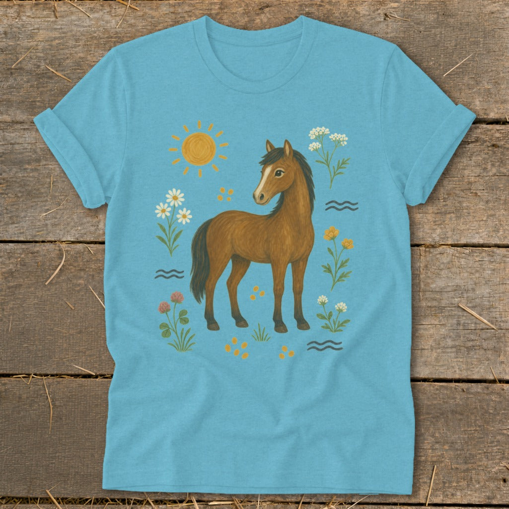 Brown horse with sun and flowers on a light blue t-shirt.