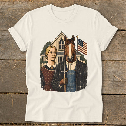A white t-shirt featuring a parody illustration of American Gothic with a horse holding a pitchfork.