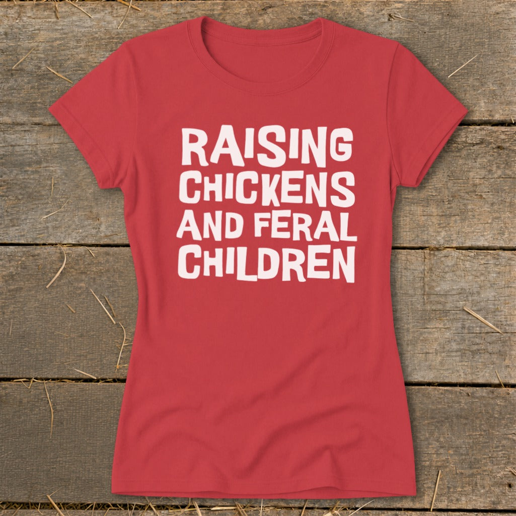 Red t-shirt with white text "RAISING CHICKENS AND FERAL CHILDREN".