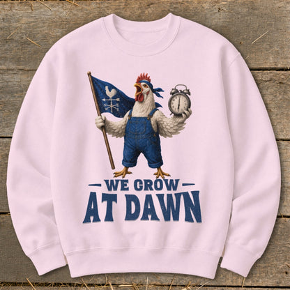 Pink sweatshirt with chicken holding flag and alarm clock, reads "We Grow At Dawn".