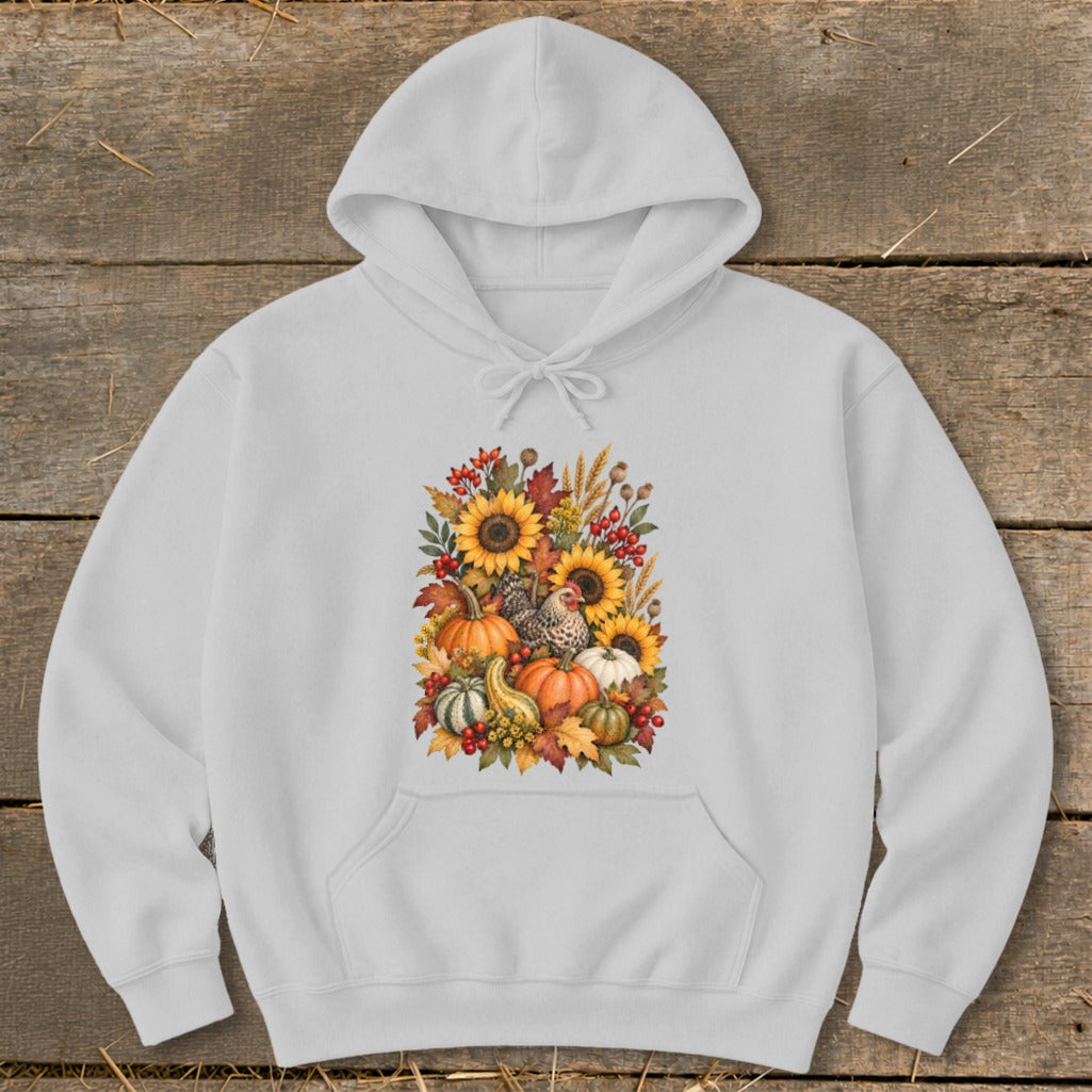 White hoodie with a watercolor design of sunflowers, pumpkins, gourds, and chickens.