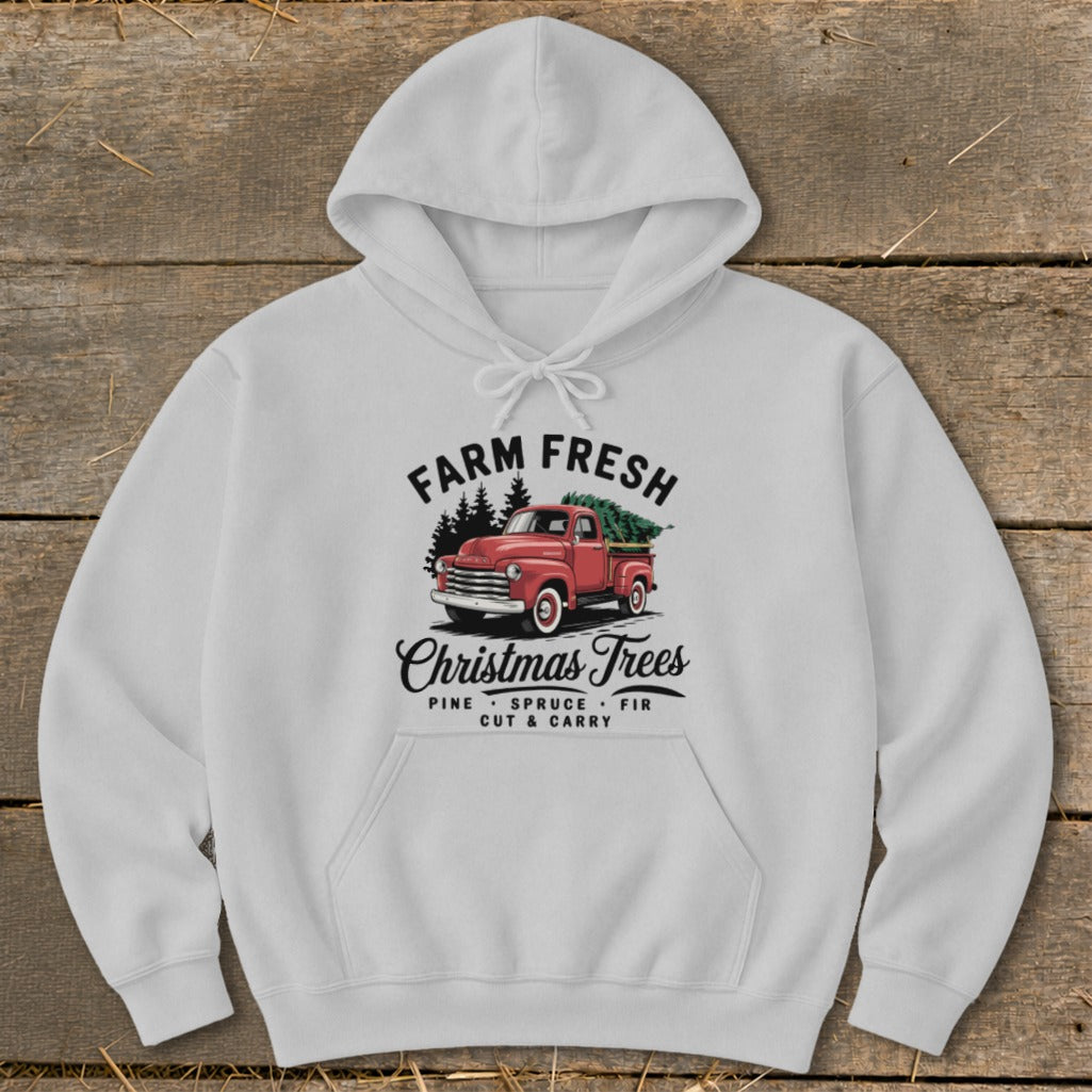 White hoodie with "Farm Fresh Christmas Trees" graphic featuring a red vintage truck hauling a tree.