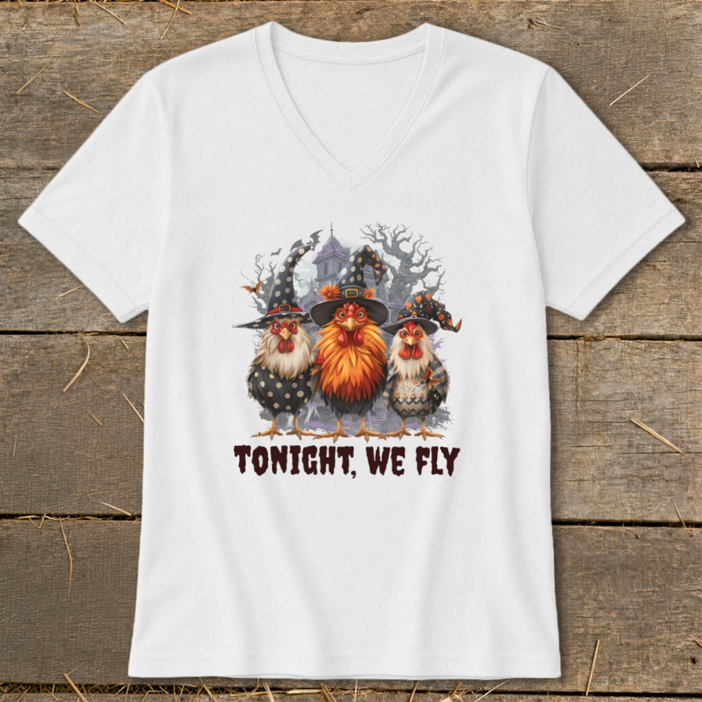 Three witch-hatted chickens in front of a spooky house, with text "TONIGHT, WE FLY."
