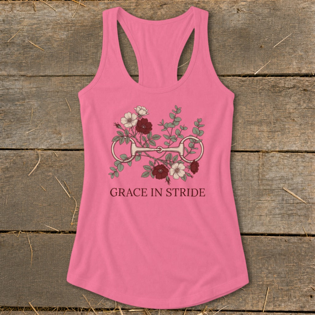 Pink tank top with floral horse bit design and text "Grace in Stride".