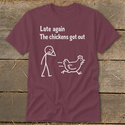 Maroon t-shirt with white text and stick figure design: "Late again The chickens got out".