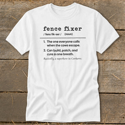 White t-shirt with "fence fixer" definition: "the one everyone calls when cows escape."
