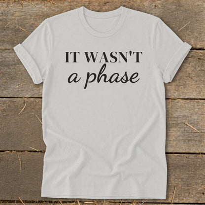 Light grey t-shirt with "IT WASN'T a phase" printed in black text.