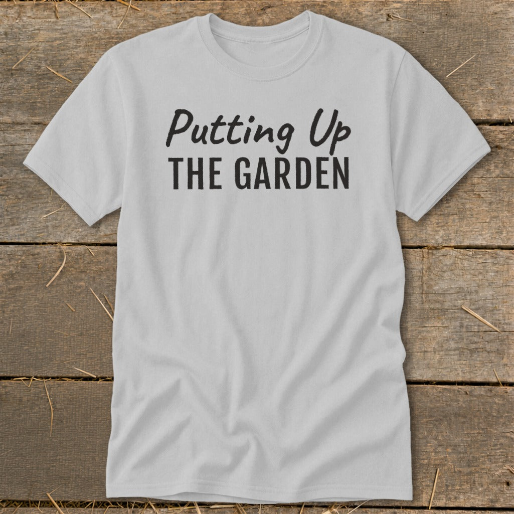 Light grey t-shirt with black text reading "Putting Up THE GARDEN".