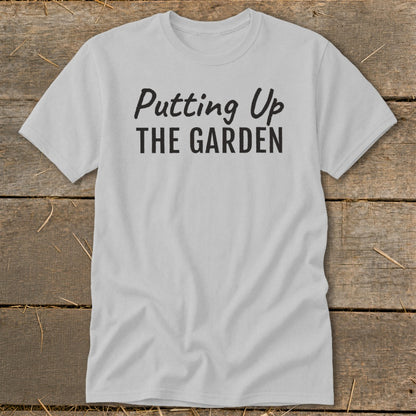 Light grey t-shirt with black text reading "Putting Up THE GARDEN".