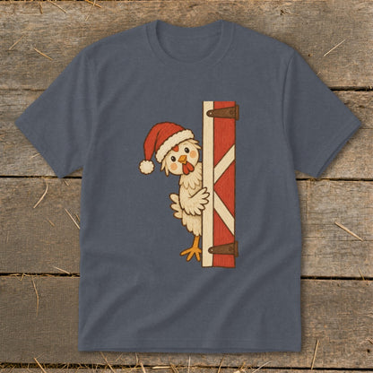 Christmas chicken wearing Santa hat peeking from behind barn door.