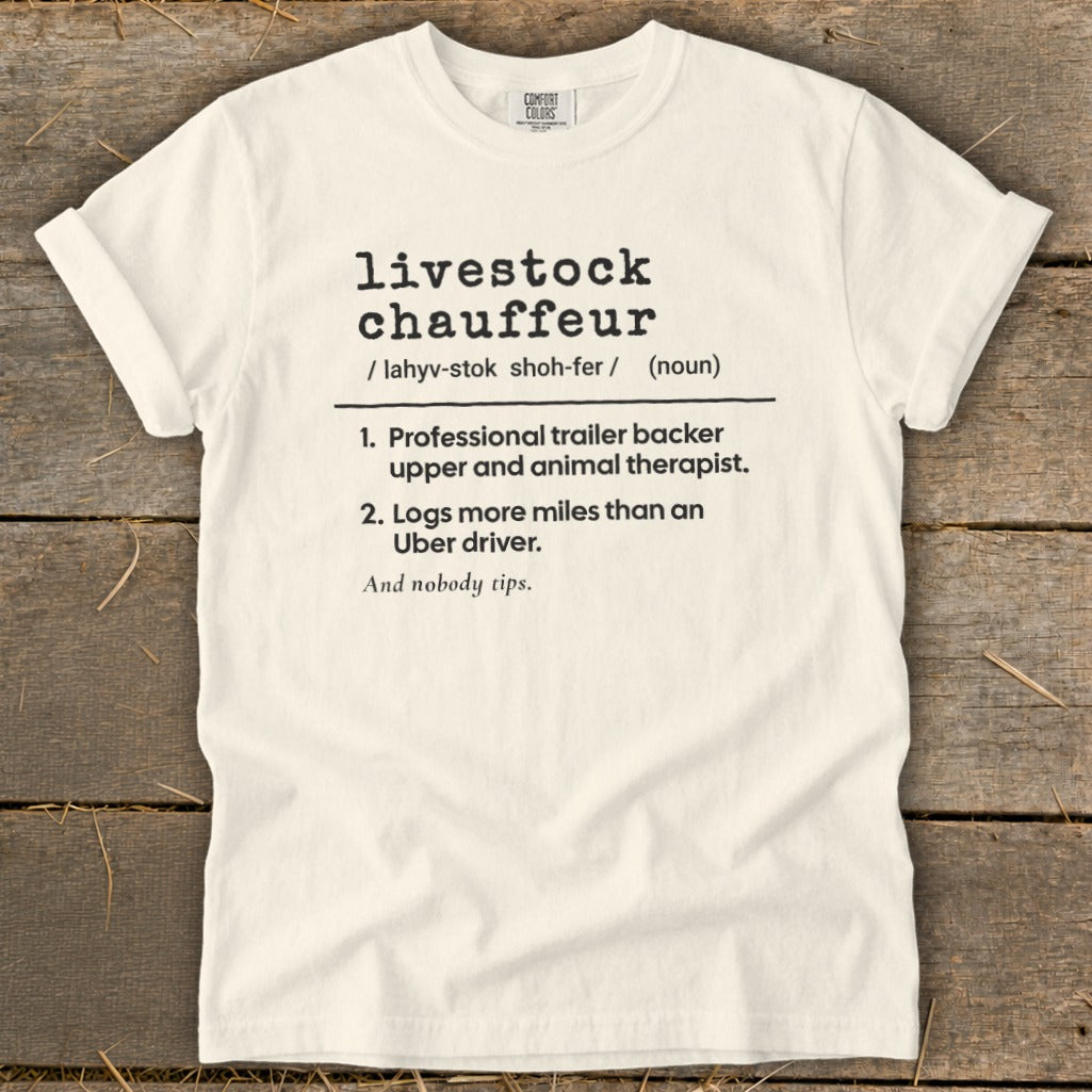 White t-shirt with black text defining "livestock chauffeur" as a professional trailer backer and animal therapist.