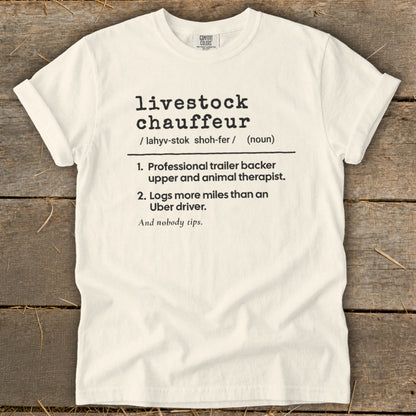 White t-shirt with black text defining "livestock chauffeur" as a professional trailer backer and animal therapist.