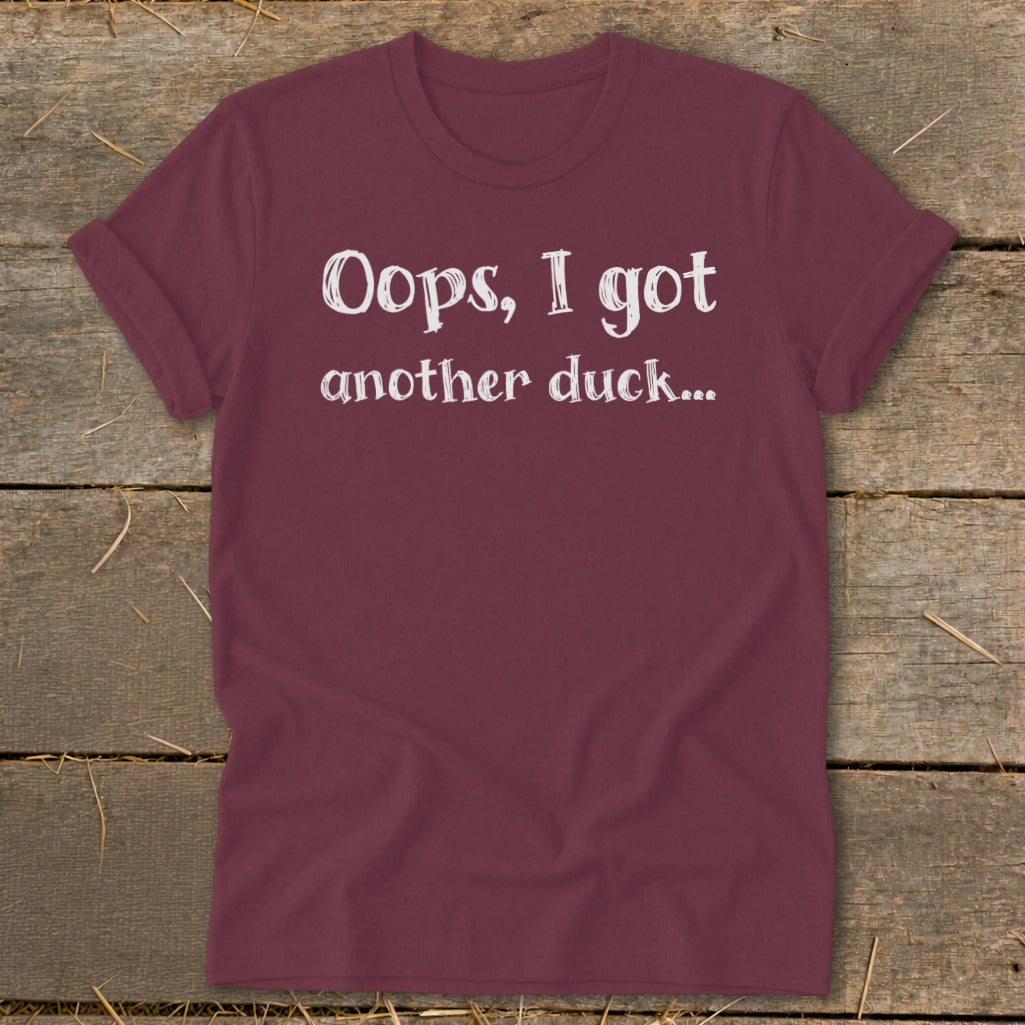 Maroon t-shirt with white text that reads "Oops, I got another duck..."