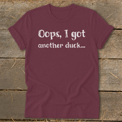 Maroon t-shirt with white text that reads "Oops, I got another duck..."