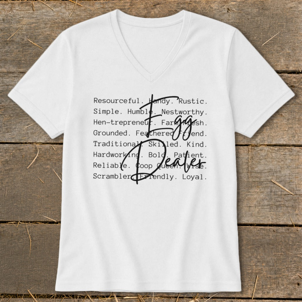White V-neck t-shirt with "Egg Dealer" and descriptive words in black text.