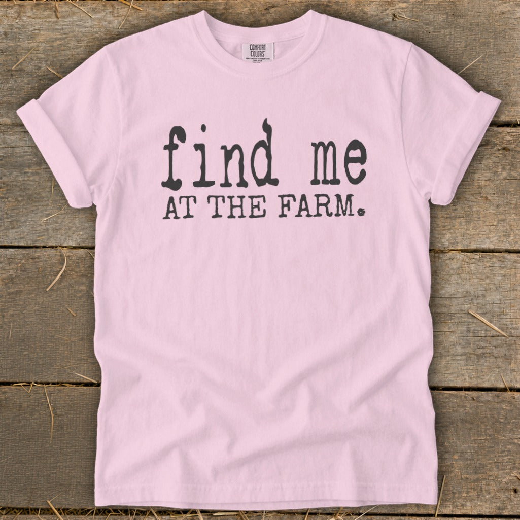 Pink t-shirt with black text reading "find me AT THE FARM."