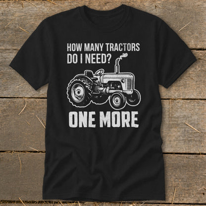 Black t-shirt with a vintage tractor and text reading "HOW MANY TRACTORS DO I NEED? ONE MORE".