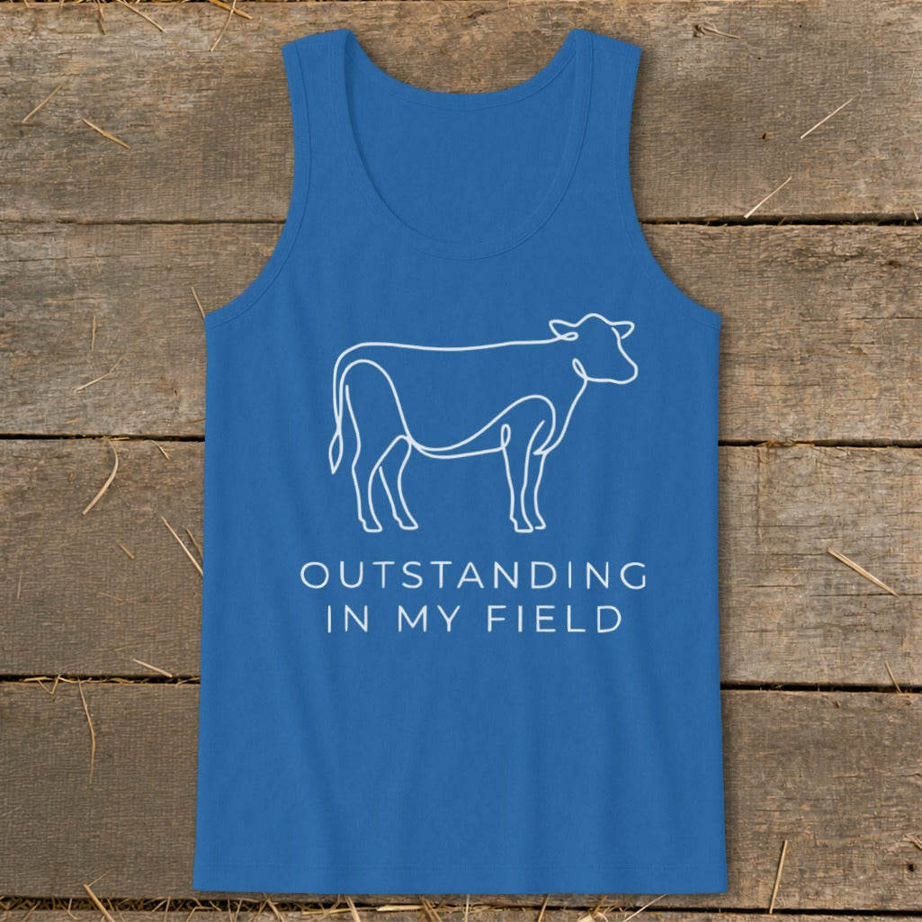 Blue tank top with white outline of a cow and text "OUTSTANDING IN MY FIELD".