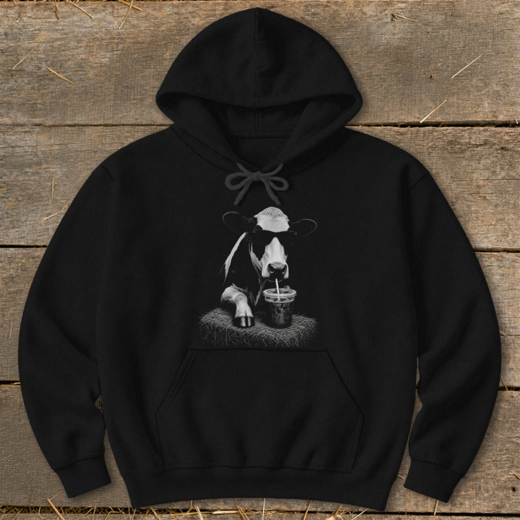 Black hoodie with a cow wearing sunglasses and drinking from a cup.