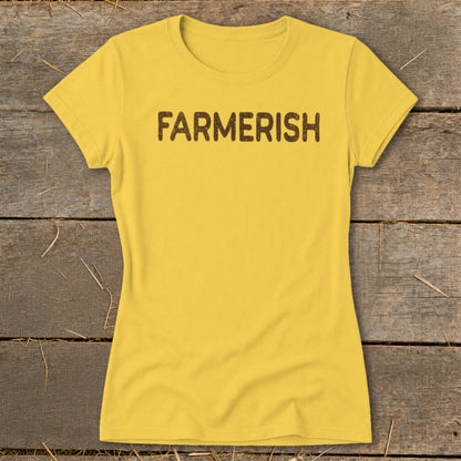 Yellow t-shirt with brown "FARMERISH" text against a wooden background.