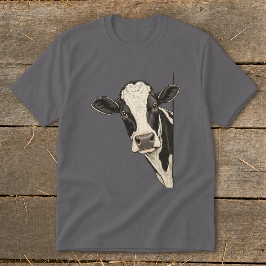 Illustration of a black and white cow peeking from behind a gray t-shirt.