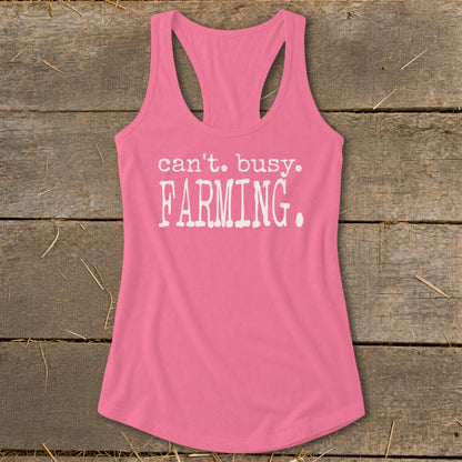 Pink racerback tank top with white text that reads "can't. busy. FARMING."