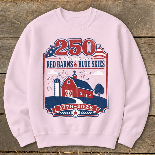 Pink sweatshirt with "250 Years of Red Barns & Blue Skies 1776-2026" graphic.
