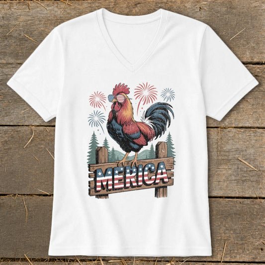 Rooster wearing American flag sunglasses on fence with "MERICA" text and fireworks.