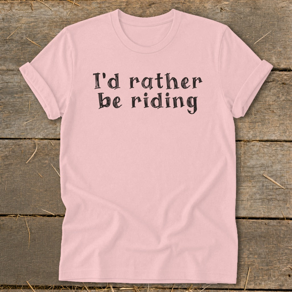 Pink t-shirt with black text "I'd rather be riding"