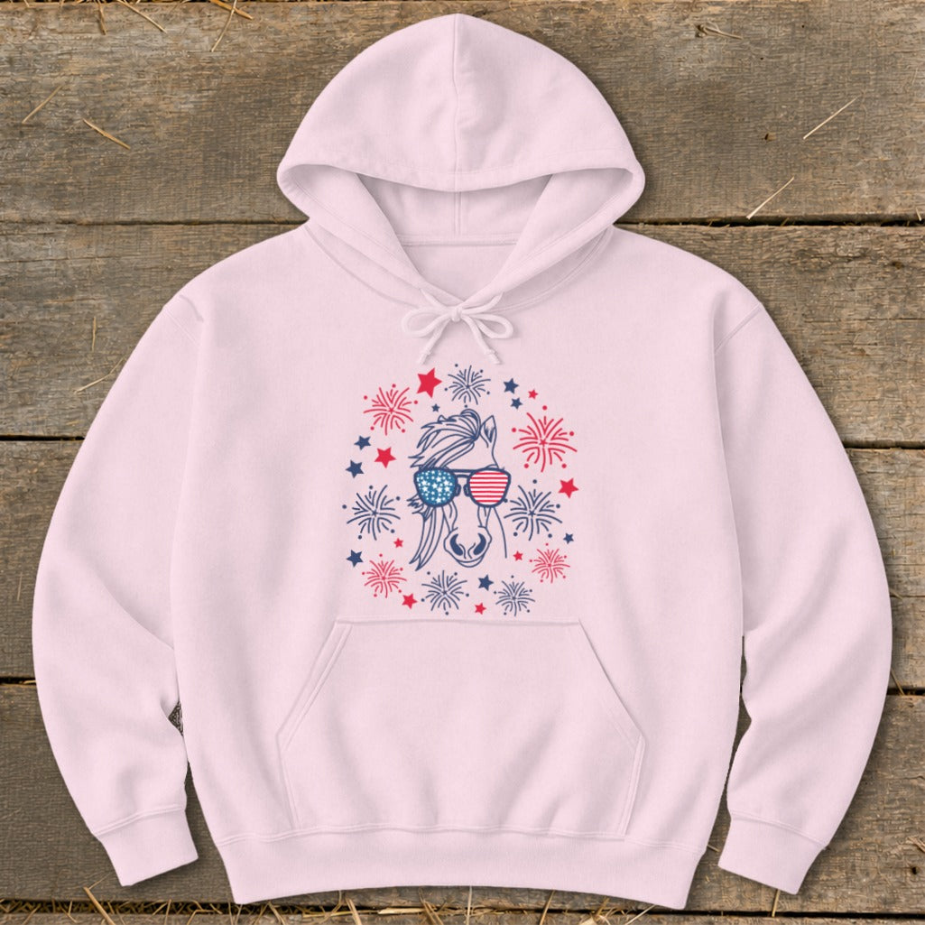 Pink hoodie with a horse wearing American flag sunglasses and surrounded by fireworks.