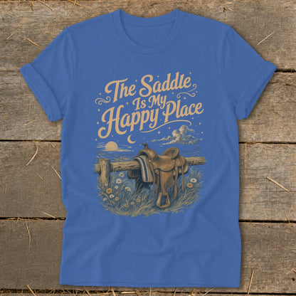 Blue t-shirt with graphic of a saddle on a fence with text "The Saddle Is My Happy Place".