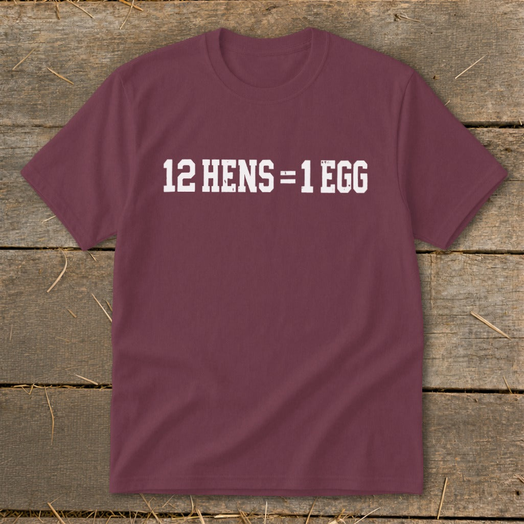 Maroon crewneck t-shirt with white distressed text reading 12 HENS = 1 EGG on the chest.