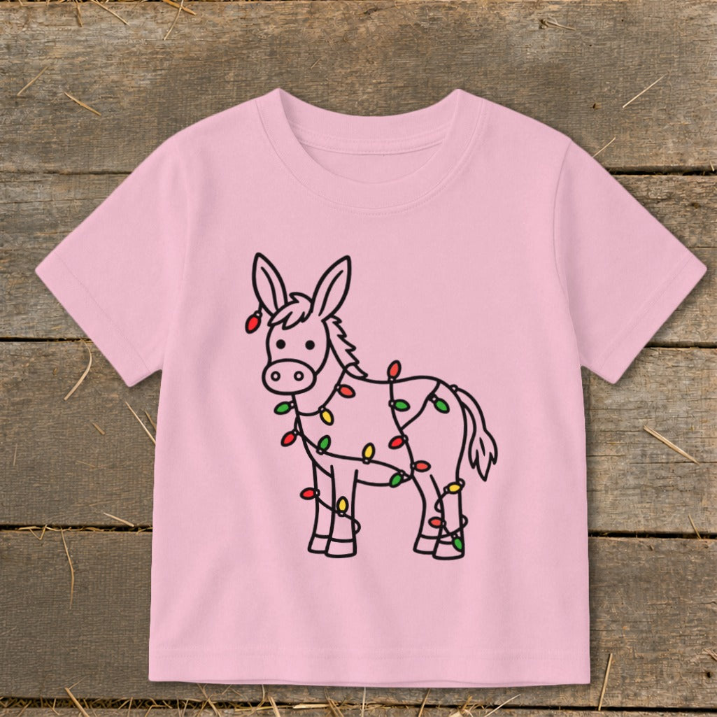 Pink t-shirt with a black outline drawing of a donkey wrapped in colorful Christmas lights.