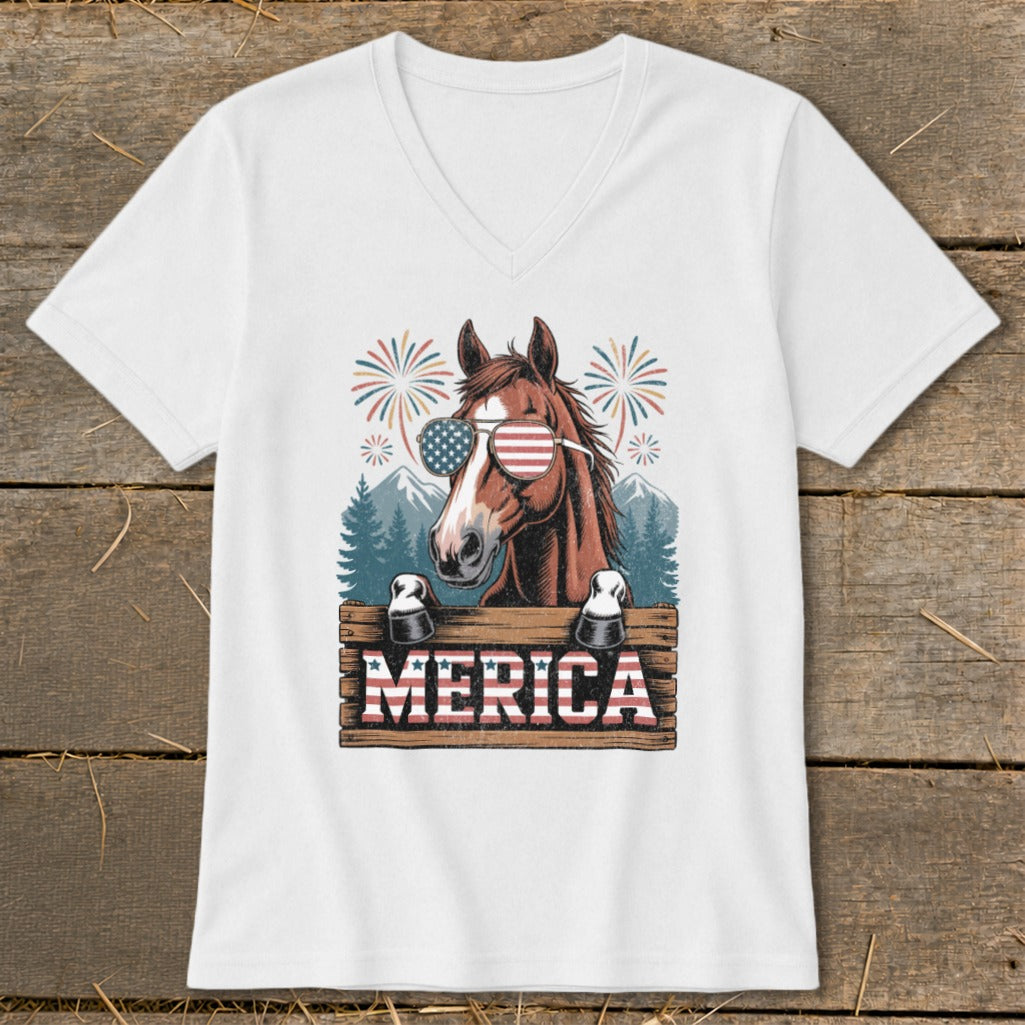 Horse wearing American flag sunglasses behind "MERICA" sign with fireworks.