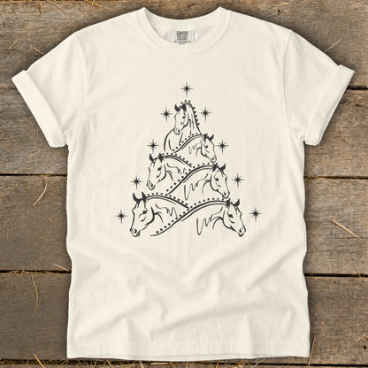 Cream t-shirt with a Christmas tree made of horse heads and stars.