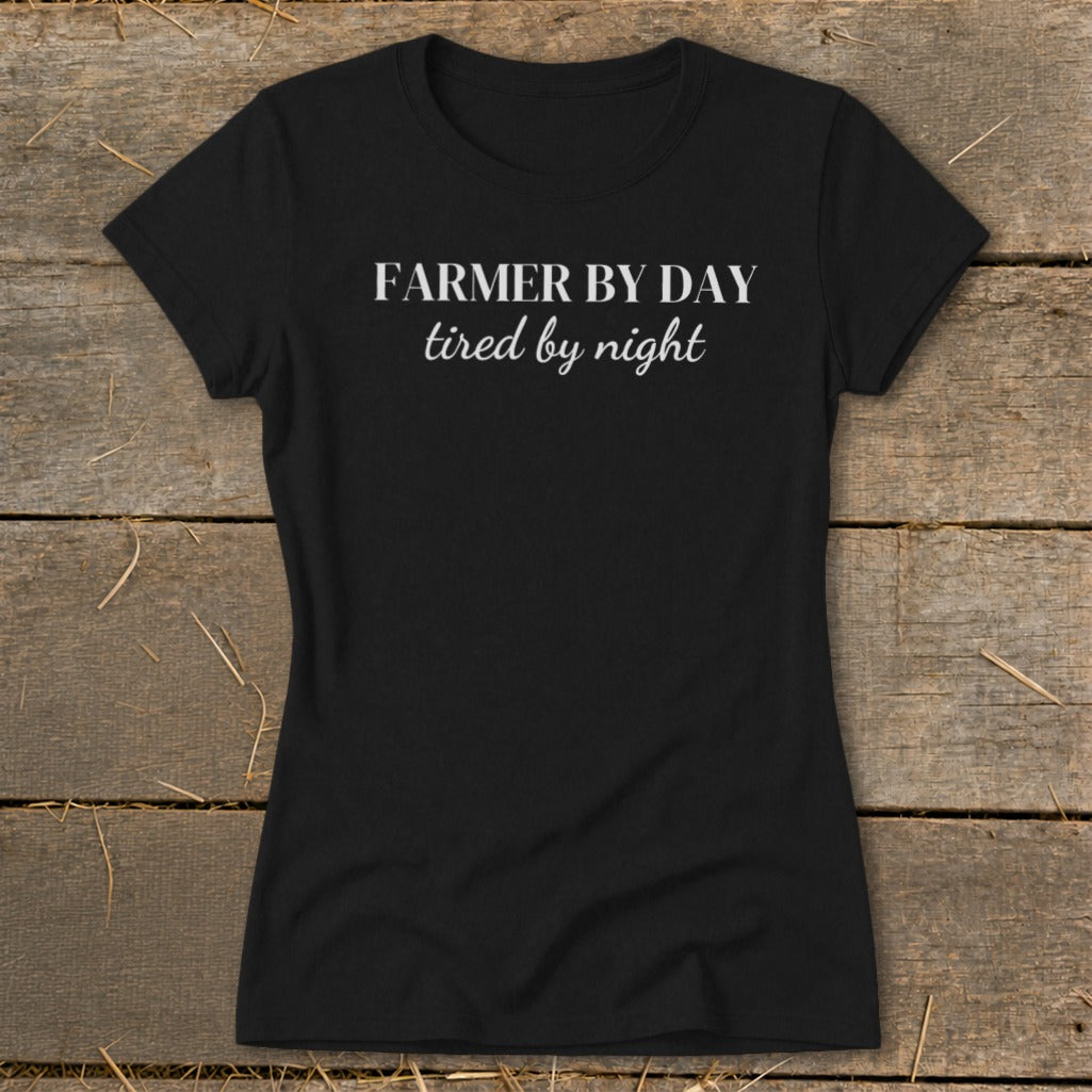 Black t-shirt with white text "Farmer by day tired by night"