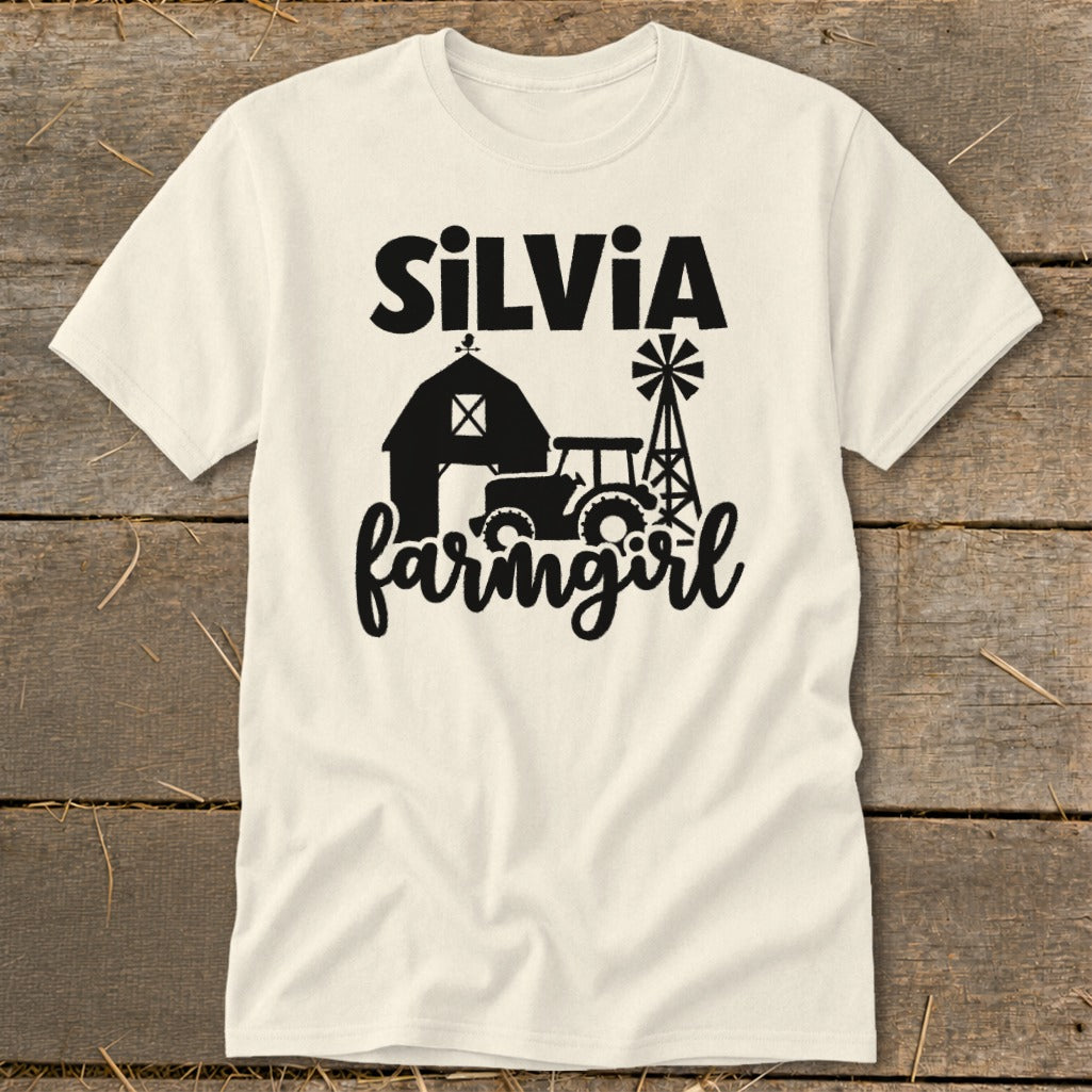 Cream t-shirt with black "SiLVIA farmgirl" text and farm graphics.