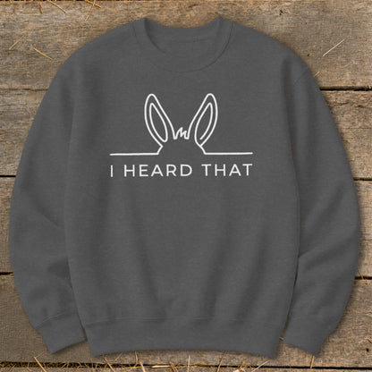 Dark grey sweatshirt with white line art of donkey ears and text "I HEARD THAT".