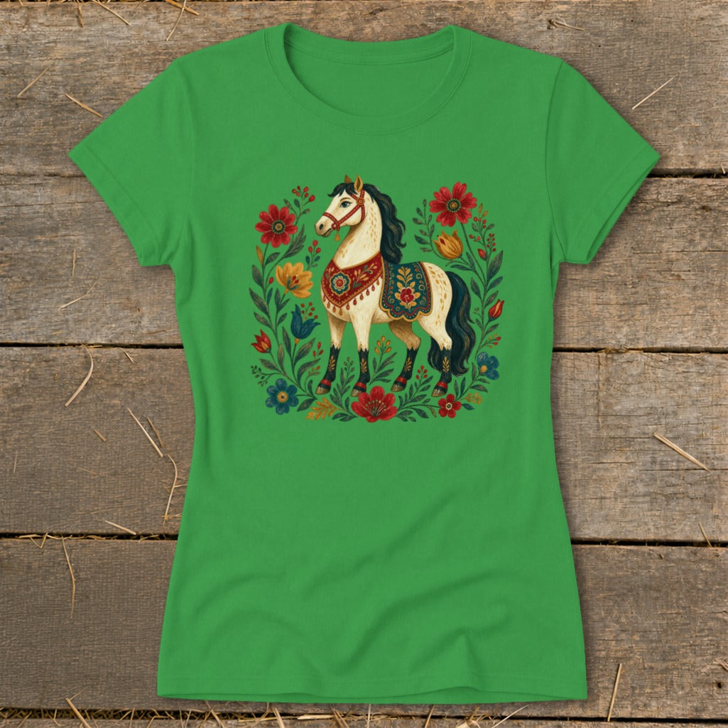 Green t-shirt with a decorative horse surrounded by colorful flowers.
