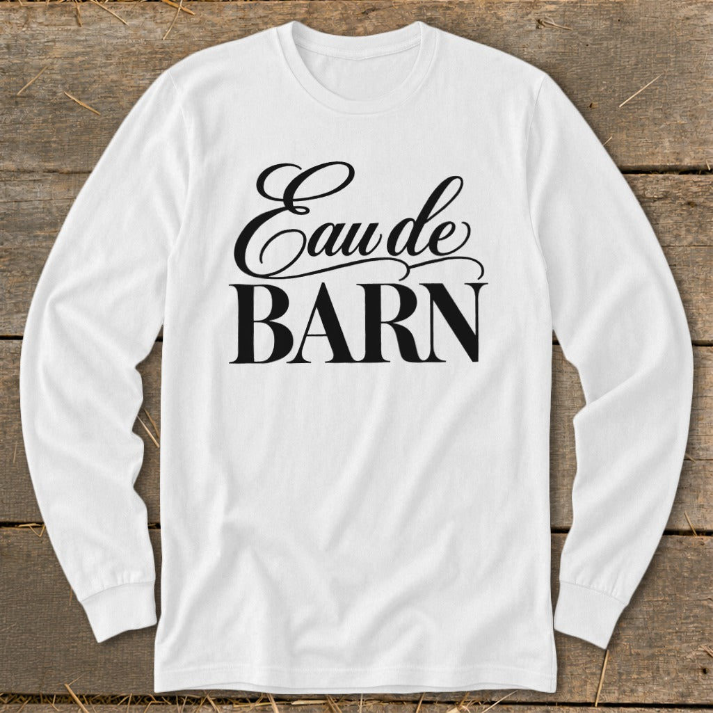 White long-sleeved shirt with "Eau de BARN" graphic print.