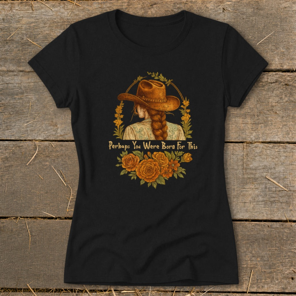 Black t-shirt with graphic of woman in cowboy hat, braided hair, and text "Perhaps You Were Born For This".