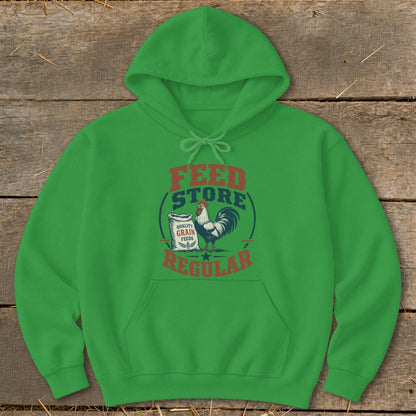 Green hoodie with "Feed Store Regular" text and a rooster and grain bag graphic.