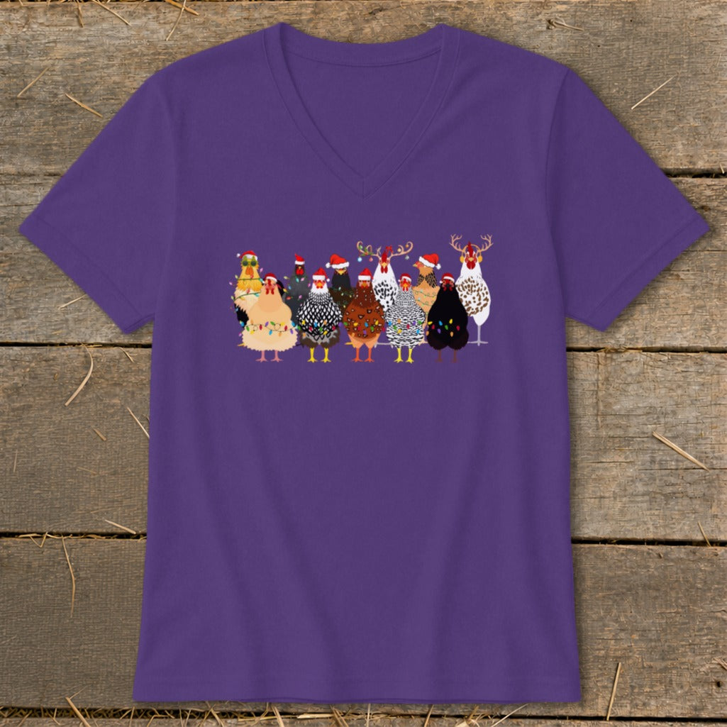 Group of chickens wearing Santa hats and Christmas lights, one with antlers.