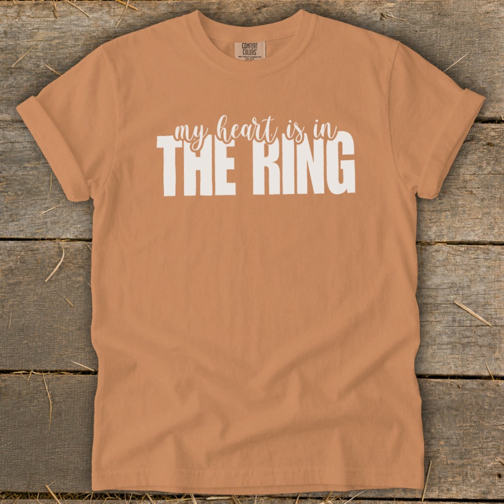 Orange t-shirt with white text "my heart is in THE RING".