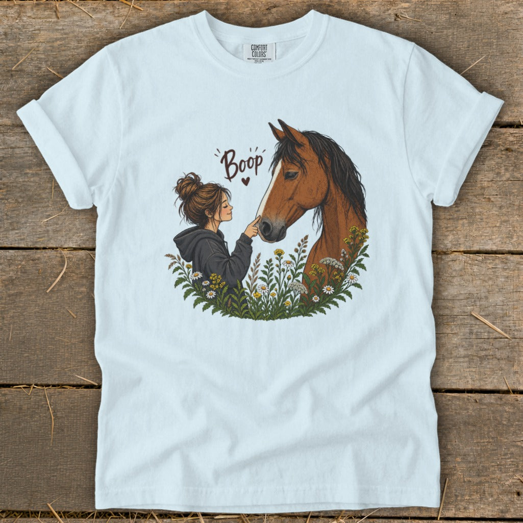 Girl with her finger touching a horse's nose, with "Boop" text.