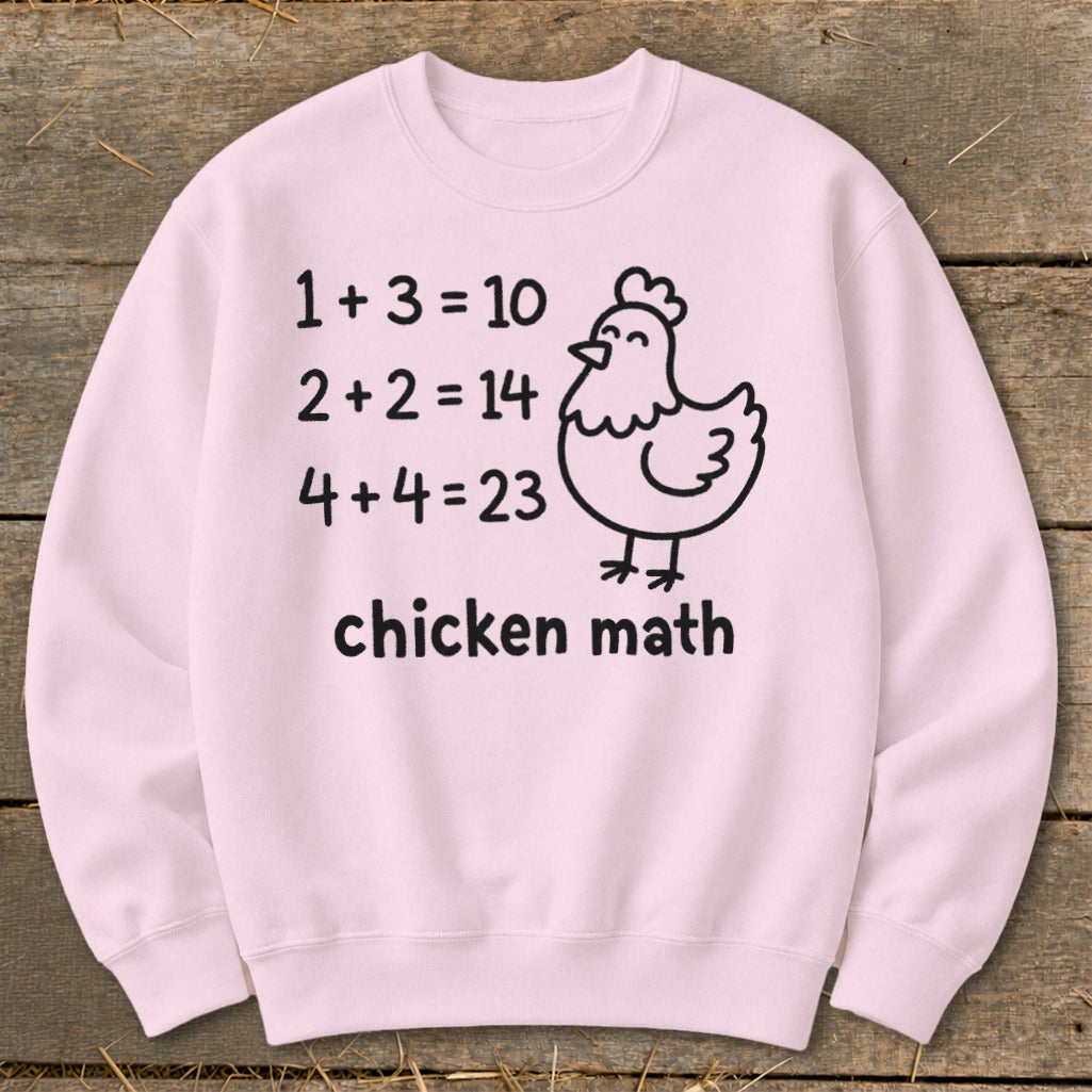 Pink sweatshirt with "chicken math" text and a cartoon chicken illustration.